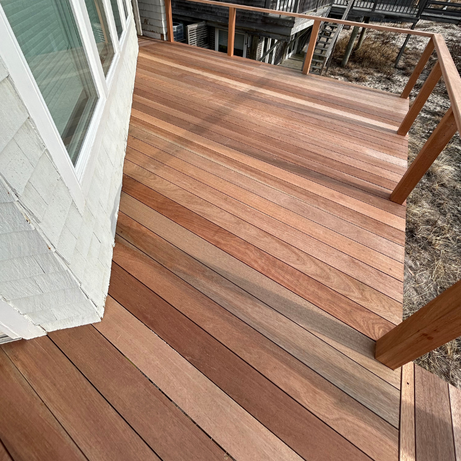 Side deck & stairs — reframed and refinished in mahogany — after