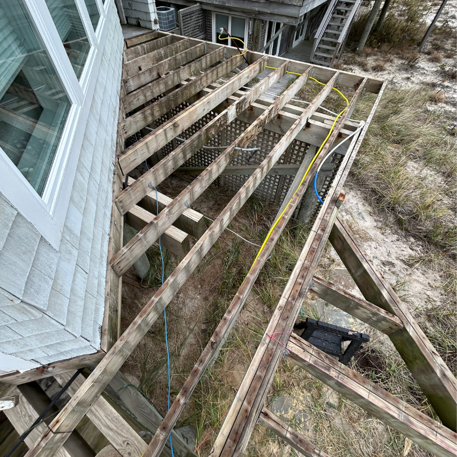 Side deck & stairs — reframed and refinished in mahogany — before