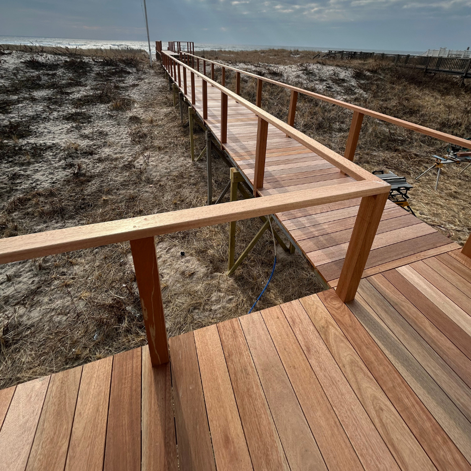 Beach boardwalk to the dunes — rebuilt in mahogany with new railings — after