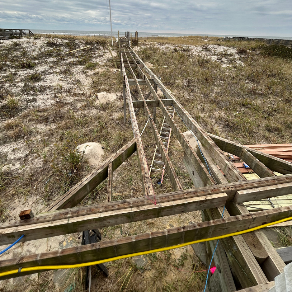 Beach boardwalk to the dunes — rebuilt in mahogany with new railings — before