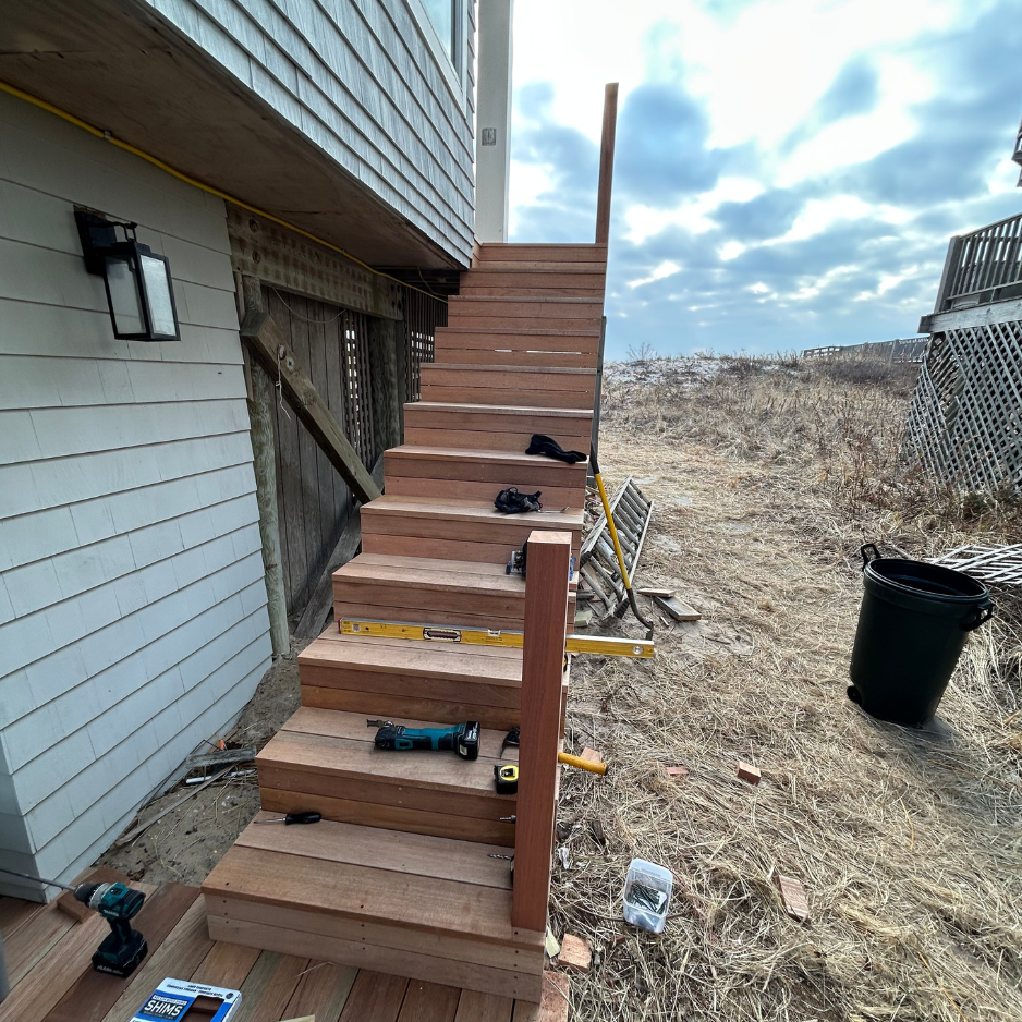 Exterior staircase — full rebuild with new mahogany treads and railings — after