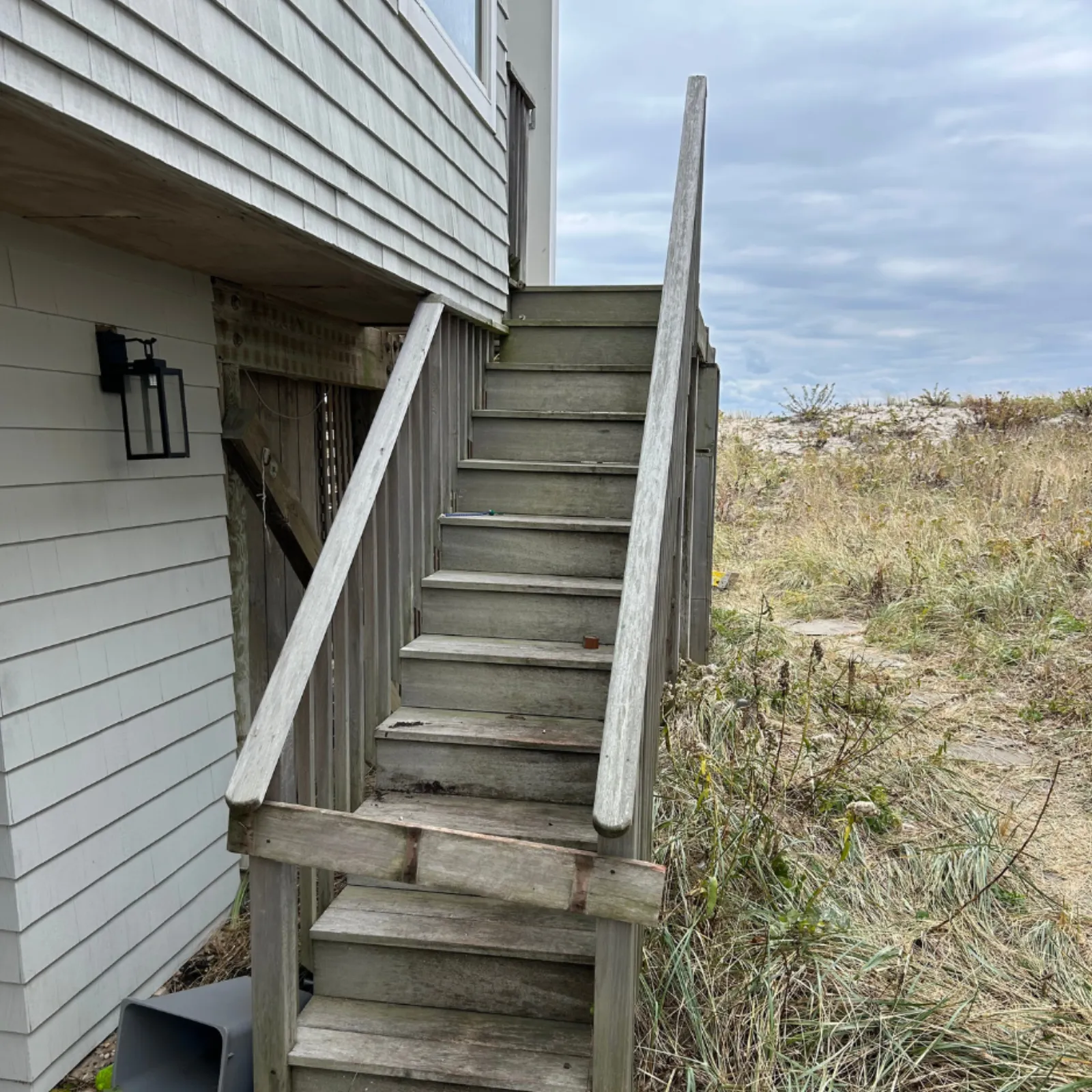 Exterior staircase — full rebuild with new mahogany treads and railings — before
